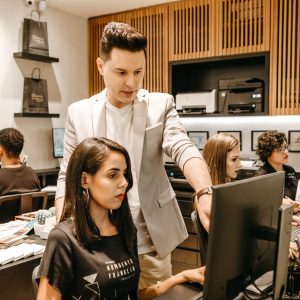 man-teaching-woman-in-front-of-monitor-3285203 man-teaching-woman-in-front-of-monitor-3285203